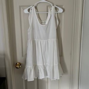 Cute little white dress. A little flowy.